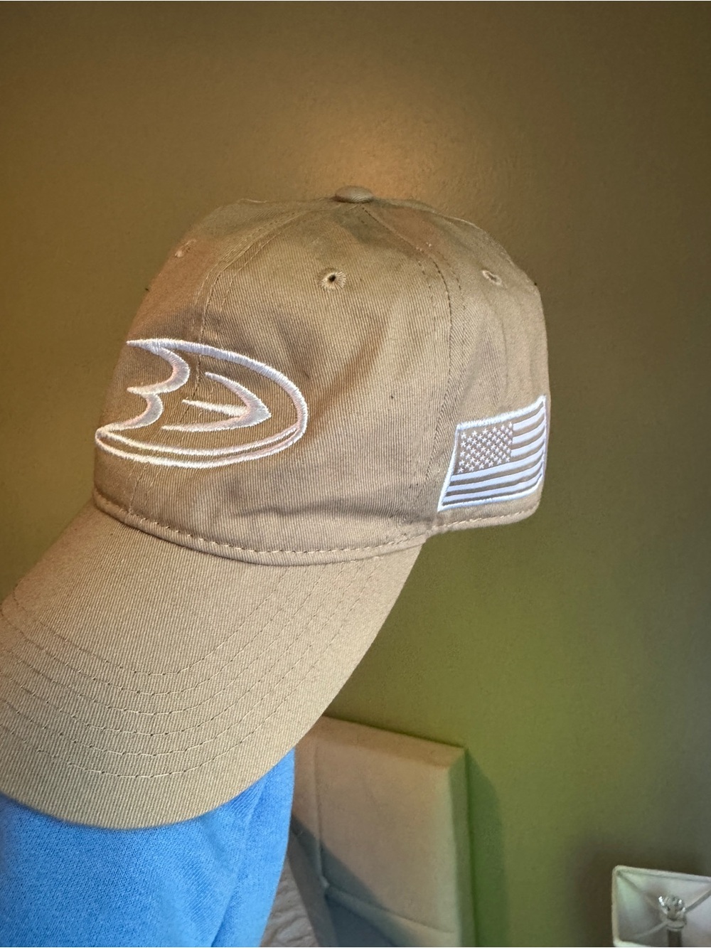Tan Baseball Cap with White Embroidered Logo and American Flag